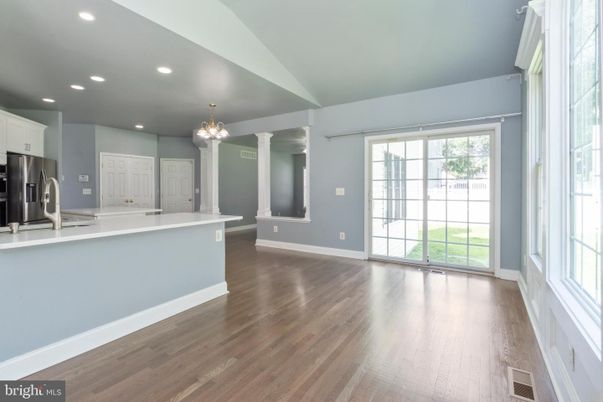 Chandelier, Empty room, Interior, Kitchen, Recessed Lighting, Stainless Steel Appliances, Wood Texture Flooring