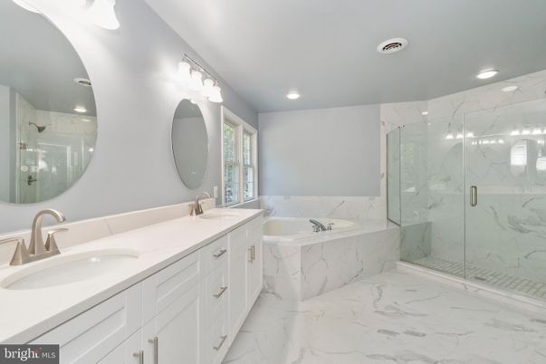 Bathroom, Dual Sink Vanities, Glass Shower, Interior, Marble, Marble Walls, Recessed Lighting