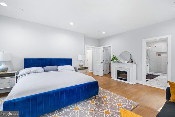 Bedroom, Fireplace, Interior, Marble, Marble Walls, Recessed Lighting, Wood Texture Flooring
