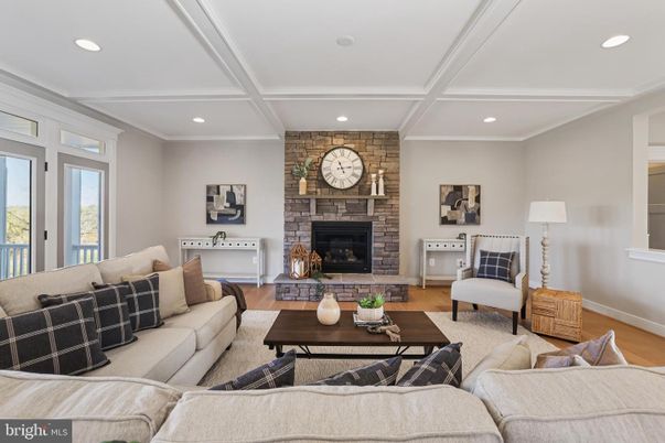 Fireplace, Interior, Living room, Recessed Lighting, Stone Walls, Wood Texture Flooring