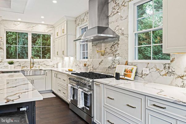 Interior, Kitchen, Marble Walls, Recessed Lighting, Stainless Steel Appliances, Wood Texture Flooring