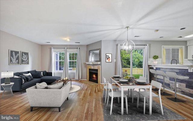 Dining room, Fireplace, Interior, Living room, Pendant Lights, Recessed Lighting, Wood Texture Flooring
