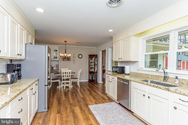 Chandelier, Dining room, Interior, Kitchen, Recessed Lighting, Stainless Steel Appliances, Wood Texture Flooring
