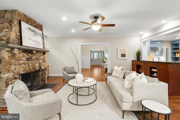 Fireplace, Interior, Living room, Recessed Lighting, Stone Walls, Wood Texture Flooring