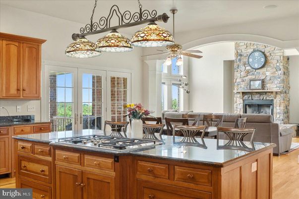 Dining room, Fireplace, Interior, Kitchen, Living room, Pendant Lights, Stone Walls, Wood Texture Flooring