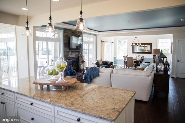 Dining room, Fireplace, Interior, Living room, Pendant Lights, Recessed Lighting, Wood Texture Flooring
