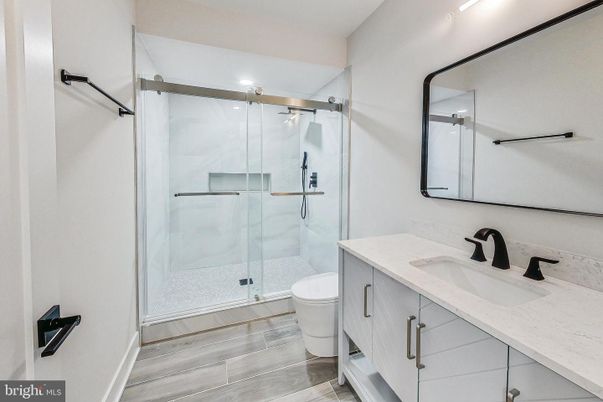 Bathroom, Glass Shower, Interior, Marble Walls, Wood Texture Flooring