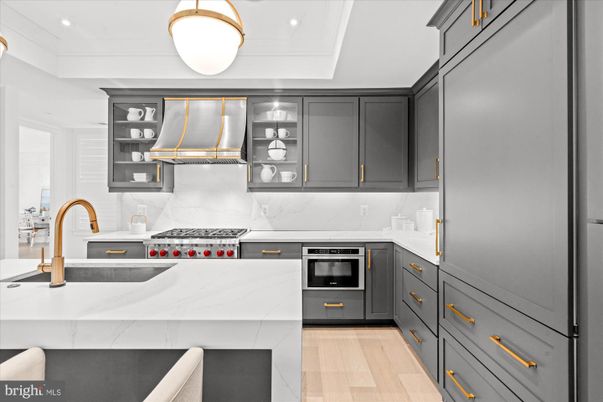 Interior, Kitchen, Marble Walls, Recessed Lighting, Stainless Steel Appliances, Wood Texture Flooring