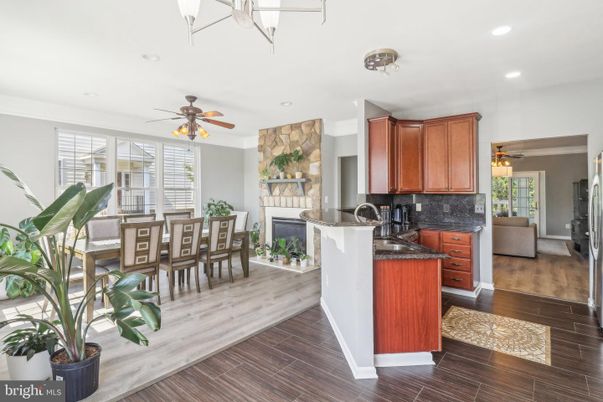 Dining room, Fireplace, Interior, Kitchen, Recessed Lighting, Wood Texture Flooring