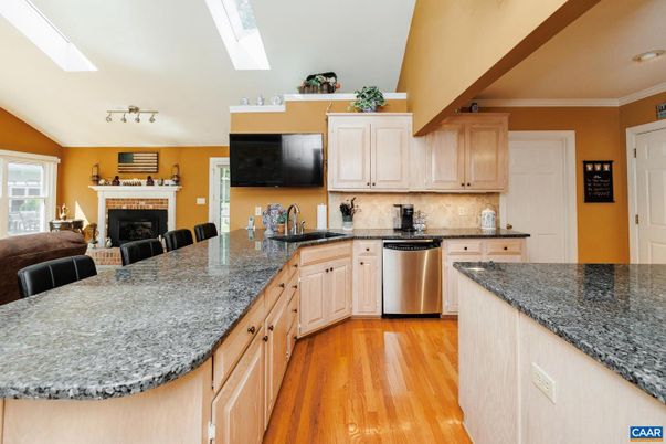Fireplace, Interior, Kitchen, Recessed Lighting, Stainless Steel Appliances, Wood Texture Flooring