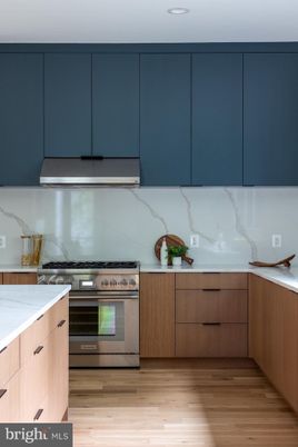 Interior, Kitchen, Marble Walls, Recessed Lighting, Stainless Steel Appliances, Wood Texture Flooring
