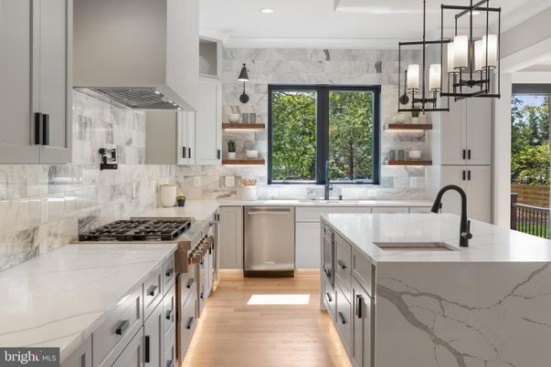 Interior, Kitchen, Marble Walls, Pendant Lights, Recessed Lighting, Stainless Steel Appliances, Wood Texture Flooring