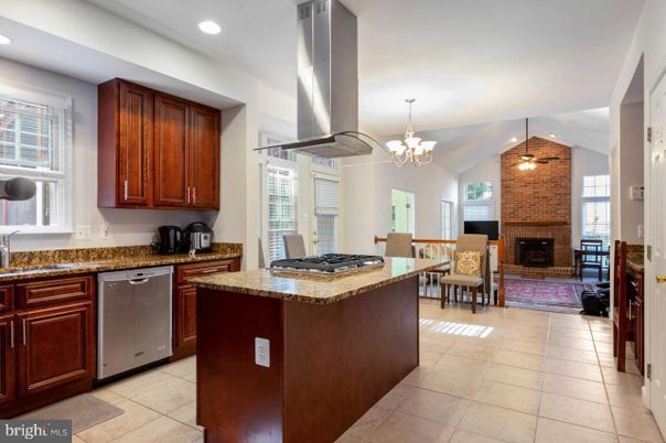 Chandelier, Dining room, Fireplace, Interior, Kitchen, Recessed Lighting, Stainless Steel Appliances, Stone Walls