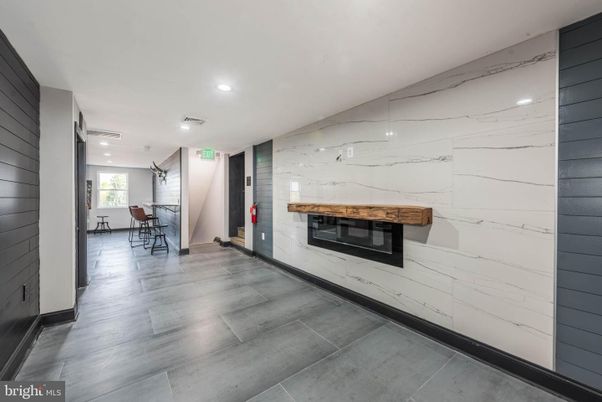 Dining room, Fireplace, Interior, Marble Walls, Recessed Lighting, Wood Texture Flooring