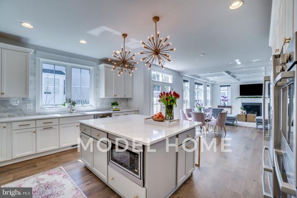 Dining room, Fireplace, Interior, Kitchen, Pendant Lights, Recessed Lighting, Stainless Steel Appliances, Wood Texture Flooring
