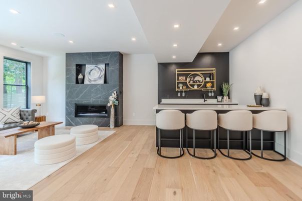 Fireplace, Interior, Marble Walls, Recessed Lighting, Wood Texture Flooring