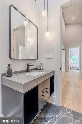 Bathroom, Dual Sink Vanities, Interior, Pendant Lights, Recessed Lighting, Wood Texture Flooring