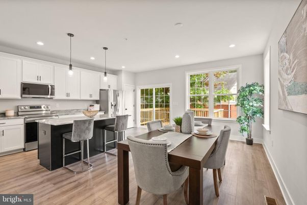 Dining room, Interior, Kitchen, Pendant Lights, Recessed Lighting, Stainless Steel Appliances, Wood Texture Flooring