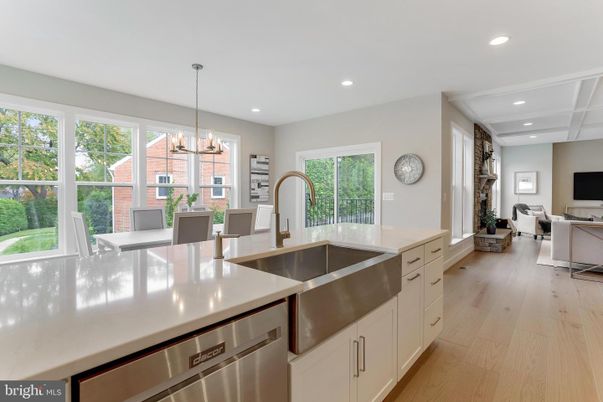 Chandelier, Dining room, Interior, Kitchen, Living room, Pendant Lights, Recessed Lighting, Stainless Steel Appliances, Wood Texture Flooring