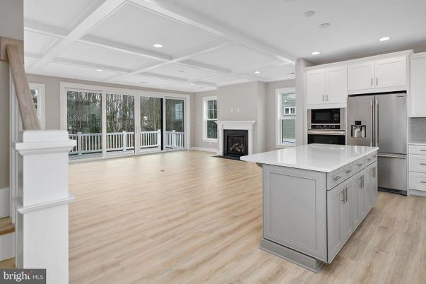 Fireplace, Interior, Kitchen, Recessed Lighting, Stainless Steel Appliances, Wood Texture Flooring