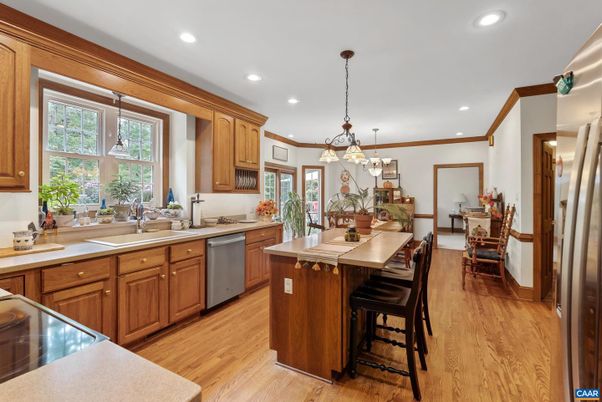 Dining room, Interior, Kitchen, Pendant Lights, Recessed Lighting, Stainless Steel Appliances, Wood Texture Flooring