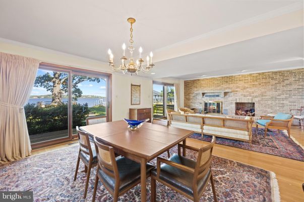 Chandelier, Dining room, Fireplace, Interior, Living room, Stone Walls, Wood Texture Flooring
