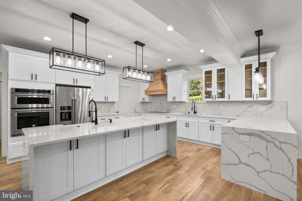 Interior, Kitchen, Marble Walls, Pendant Lights, Recessed Lighting, Stainless Steel Appliances, Wood Texture Flooring