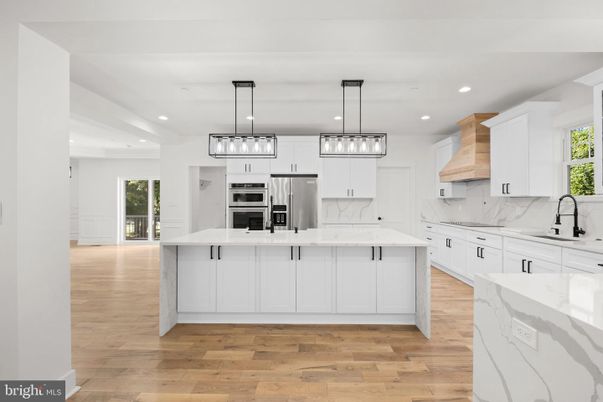 Interior, Kitchen, Marble Walls, Pendant Lights, Recessed Lighting, Stainless Steel Appliances, Wood Texture Flooring