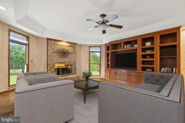 Fireplace, Interior, Living room, Recessed Lighting, Stone Walls, Wood Texture Flooring