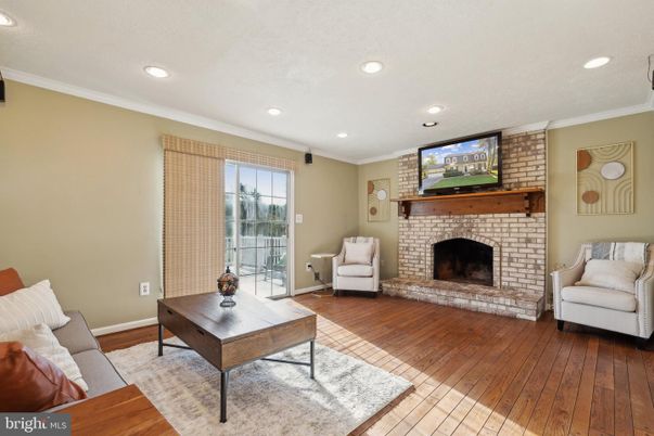 Fireplace, Interior, Living room, Recessed Lighting, Stone Walls, Wood Texture Flooring