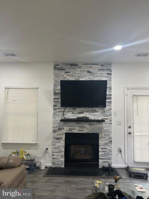Fireplace, Interior, Recessed Lighting, Stone Walls, Wood Texture Flooring