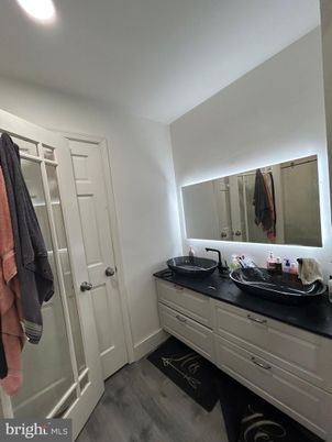 Bathroom, Dual Sink Vanities, Interior, Recessed Lighting, Walk-in Closets, Wood Texture Flooring