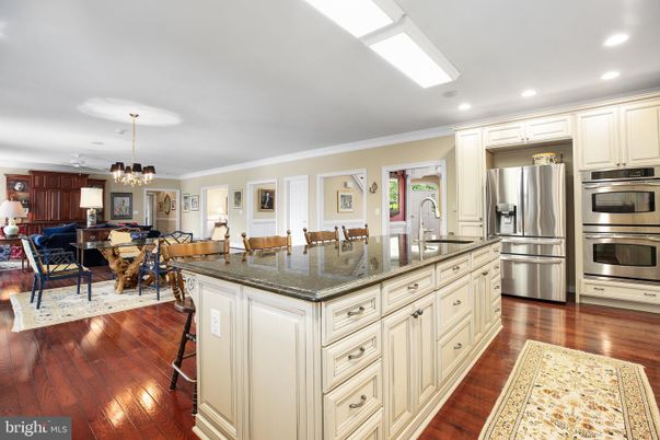 Chandelier, Dining room, Interior, Kitchen, Living room, Recessed Lighting, Stainless Steel Appliances, Wood Texture Flooring