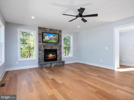 Empty room, Fireplace, Interior, Recessed Lighting, Stone Walls, Wood Texture Flooring