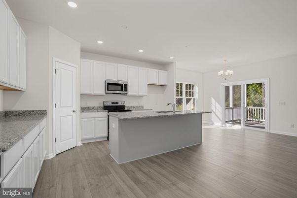 Chandelier, Interior, Kitchen, Recessed Lighting, Stainless Steel Appliances, Wood Texture Flooring