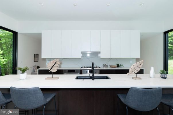 Interior, Kitchen, Marble Walls, Recessed Lighting, Stainless Steel Appliances