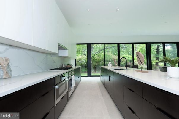 Interior, Kitchen, Marble Walls, Recessed Lighting, Stainless Steel Appliances