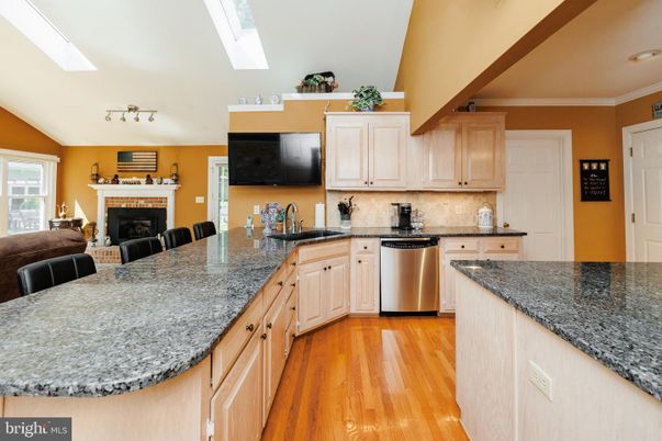 Fireplace, Interior, Kitchen, Recessed Lighting, Stainless Steel Appliances, Wood Texture Flooring