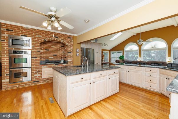Interior, Kitchen, Recessed Lighting, Stainless Steel Appliances, Stone Walls, Wood Texture Flooring
