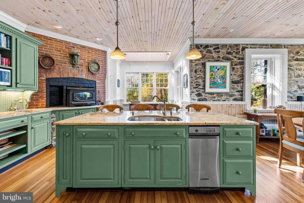 Fireplace, Interior, Kitchen, Pendant Lights, Recessed Lighting, Stainless Steel Appliances, Stone Walls, Wooden Ceilings, Wood Texture Flooring