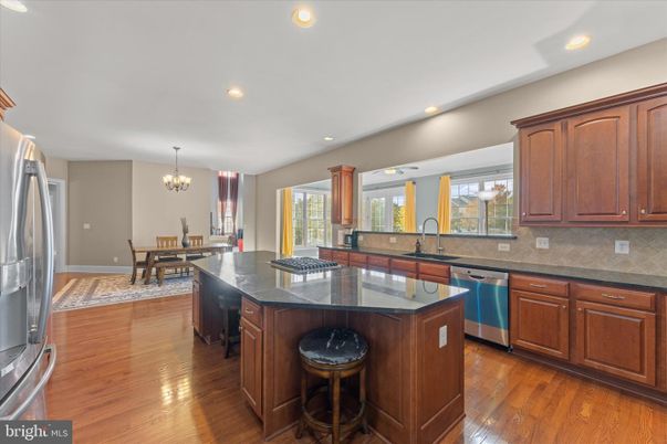 Chandelier, Dining room, Interior, Kitchen, Recessed Lighting, Stainless Steel Appliances, Wood Texture Flooring