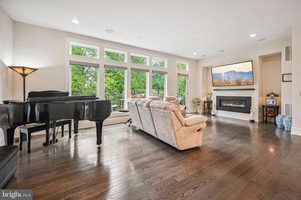 Fireplace, Interior, Living room, Piano, Recessed Lighting, Wood Texture Flooring