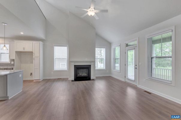 Empty room, Fireplace, Interior, Kitchen, Pendant Lights, Recessed Lighting, Wood Texture Flooring