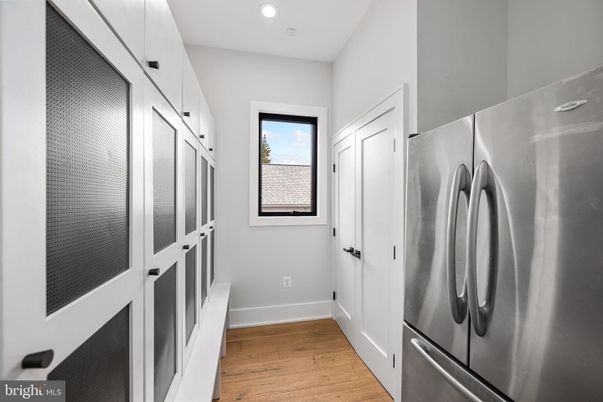 Interior, Recessed Lighting, Stainless Steel Appliances, Washer, Wood Texture Flooring