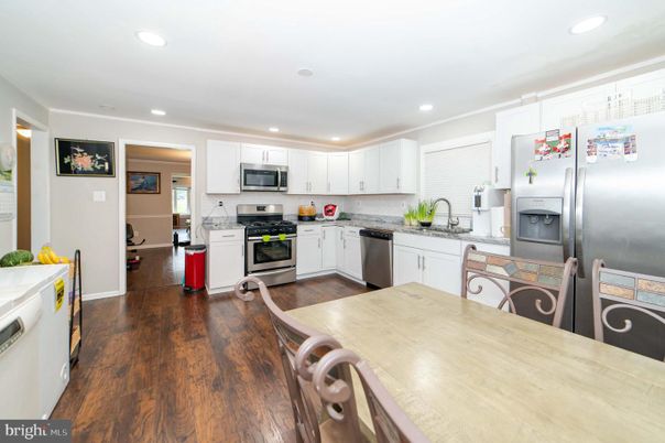 Dining room, Interior, Kitchen, Recessed Lighting, Stainless Steel Appliances, Wood Texture Flooring
