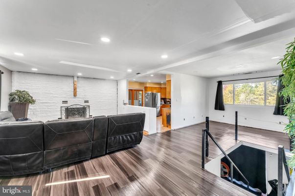 Fireplace, Interior, Kitchen, Living room, Recessed Lighting, Stone Walls, Wood Texture Flooring