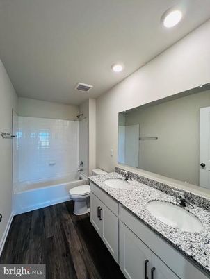 Bathroom, Dual Sink Vanities, Interior, Recessed Lighting, Wood Texture Flooring
