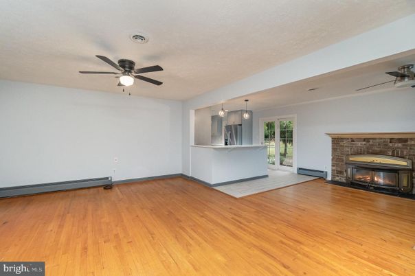 Empty room, Fireplace, Interior, Kitchen, Pendant Lights, Wood Texture Flooring