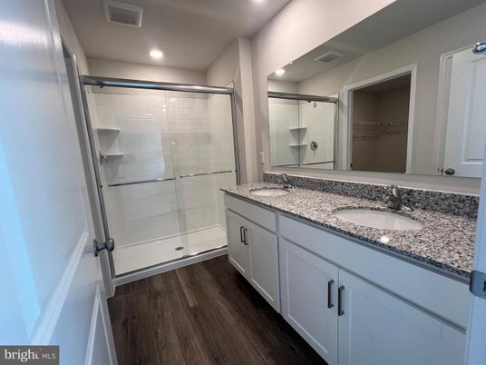 Bathroom, Dual Sink Vanities, Glass Shower, Interior, Recessed Lighting, Wood Texture Flooring