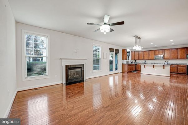 Empty room, Fireplace, Interior, Kitchen, Pendant Lights, Recessed Lighting, Wood Texture Flooring